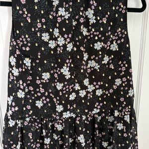 Loft black floral sleeveless top. Loose fit with peplum bottom.